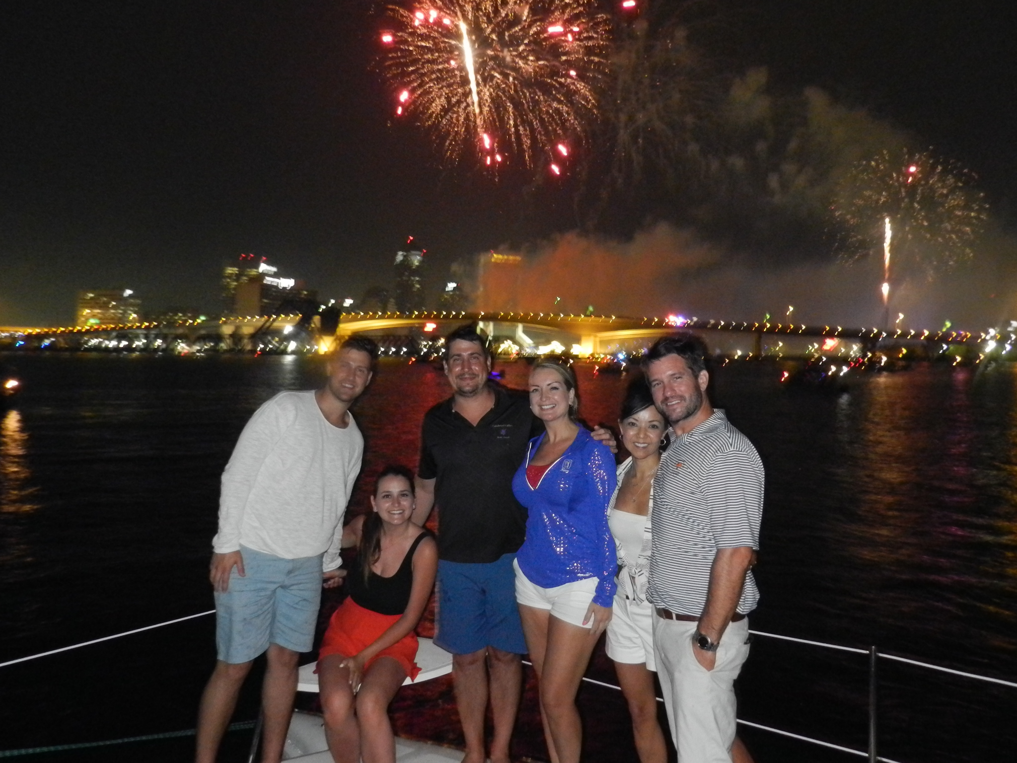 Guests celebrating July 4th fireworks on the St. John's River aboard Now and Zen